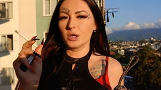 Domina Nikasexyly smokes, uses slave as ashtray on balcony
