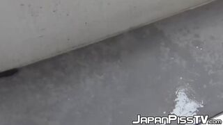 Gorgeous Oriental minx spilling urine on staircase