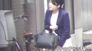 Close up video of Japanese girls pissing in public toilet
