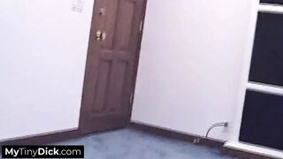 A hot brunette tattooed temptress sucking his small cock