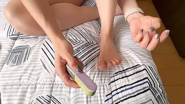 Beautiful hot woman enjoys nail art and foot play leading to intense orgasms